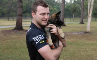 Jeff Horn holds Hornet the dog