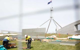 A fence goes up around Parliament House