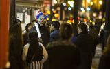WASHINGTON, USA - OCTOBER 31: A creepy clown walks down the sidewalk during Halloween in the Georgetown neighborhood of Washington, USA on October 31, 2015. (Photo by Samuel Corum/Anadolu Agency/Getty Images)