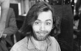 Charles Manson sticks his tongue out