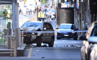 A white four-wheel drive is pictured at the scene of the Flinders Street carnage in Melbourne.