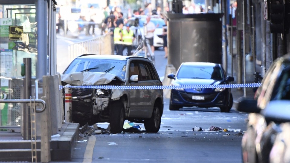 A white four-wheel drive is pictured at the scene of the Flinders Street carnage in Melbourne.