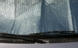 Car windshield being protected from the sun