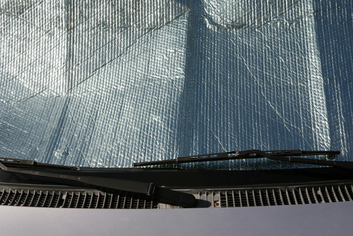 Car windshield being protected from the sun