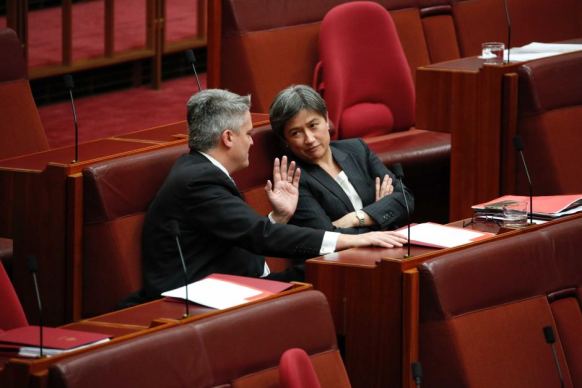 Mathias Cormann speaks to Penny Wong