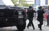 Tactical police at a media event on the Gold Coast take part in a training drill for the Commonwealth Games.