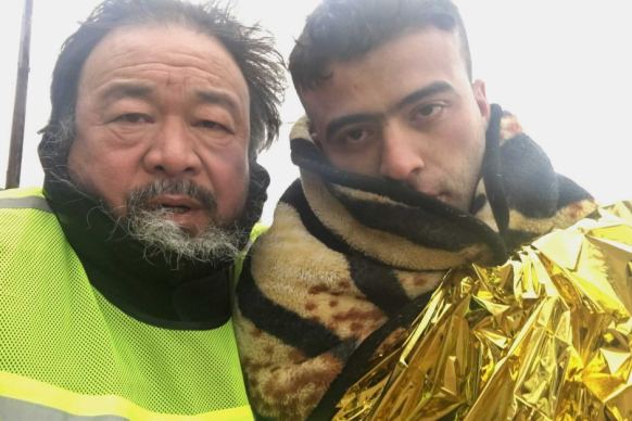 Ai Weiwei with a refugee on the Greek Island of Lesvos