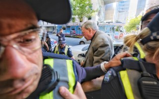Cardinal George Pell arrives at court
