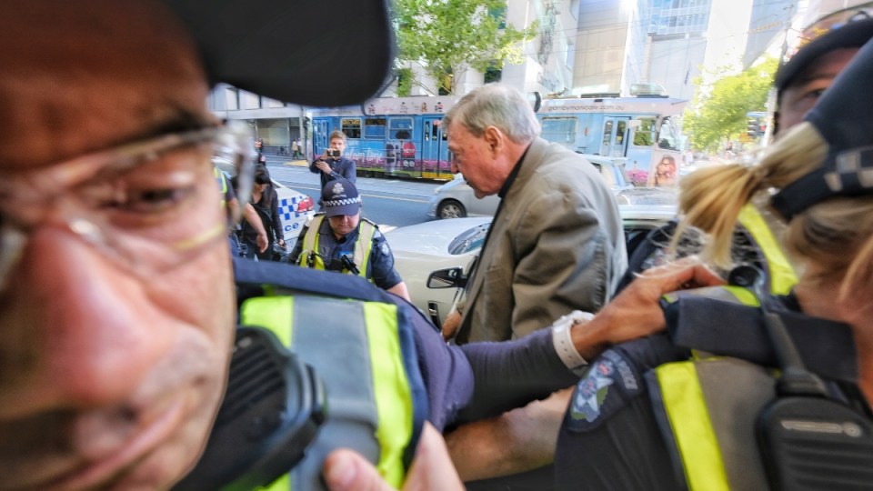 Cardinal George Pell arrives at court