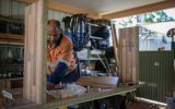 Glenn Palman works in his shed in Leinster, WA