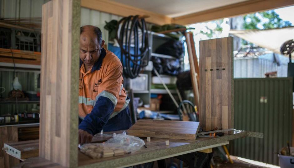 Glenn Palman works in his shed in Leinster, WA