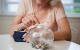 Budget: A woman places her superannuation in an account