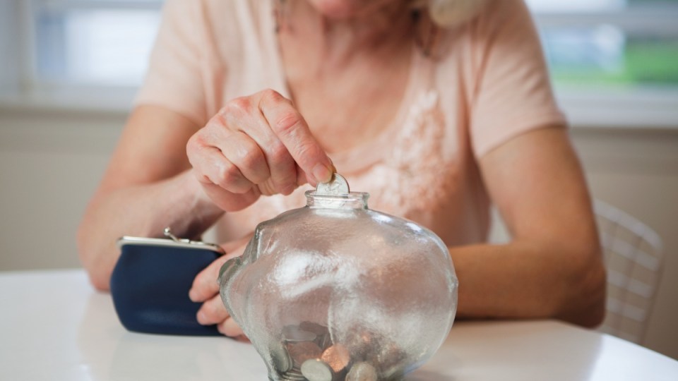 Budget: A woman places her superannuation in an account