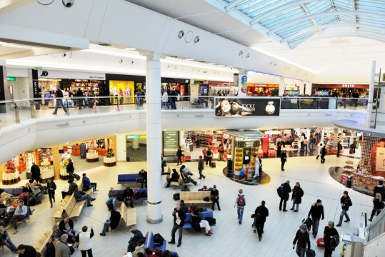 You might have scored a bargain with that cheap flight ... but time spent at the airport shopping, eating and drinking can be expensive.