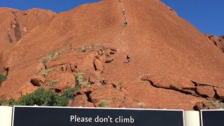 girl fall climb uluru