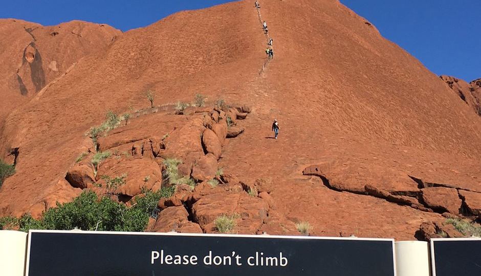 girl fall climb uluru