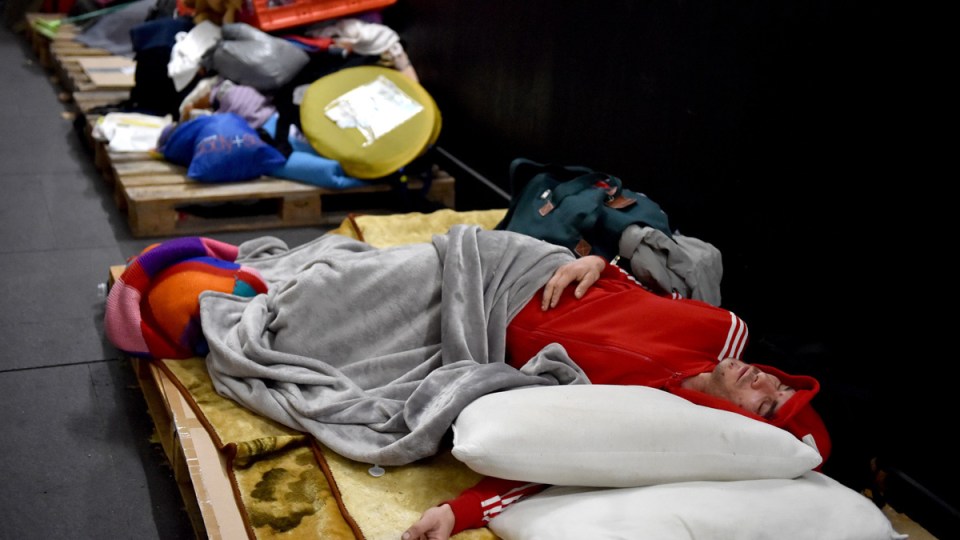 Homeless man sleeping in Sydney's CBD