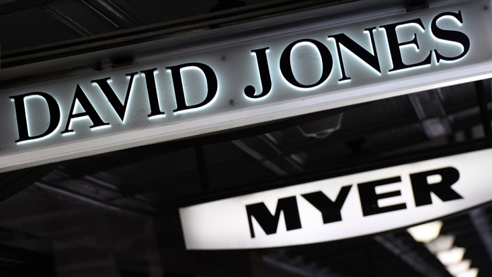 Signs for David Jones and Myer hang from an awning.