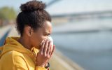Woman sneezing
