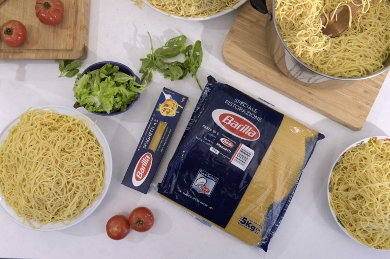 A standard 500 gram pack of pasta next to Coles' supersized "big value pack".