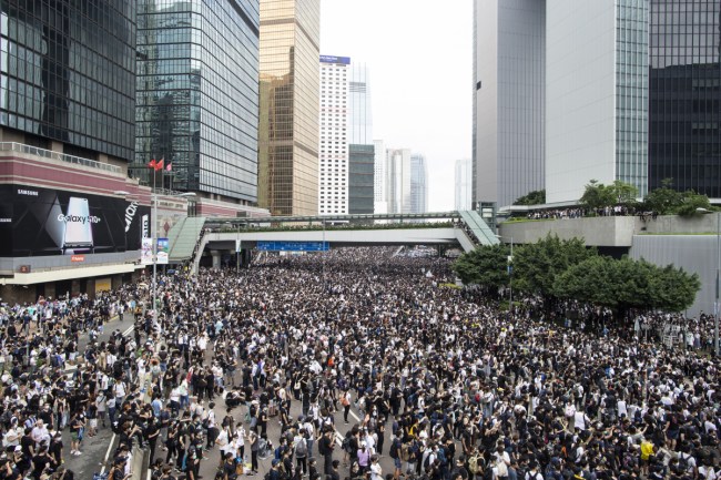 Thousands of protesters occupied the roads near the Legislative Council Complex in Hong Kong to demand to government to withdraw extradition bill. Photo: AAP