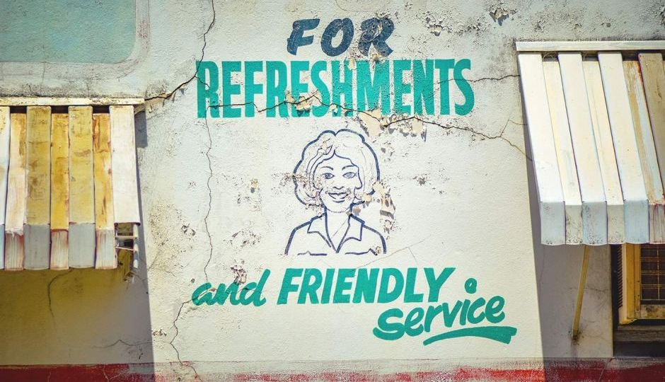 A painted sign for an old deli, fruit vendor in East Victoria Park