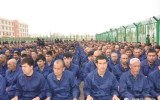 Detainees in a Xinjiang Re-education Camp listening to "de-radicalisation" talks last year. Photo: Chinese TV