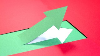 A green arrow ascending