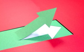 A green arrow ascending