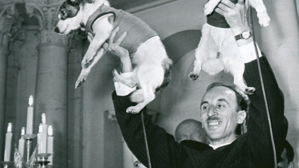 Oleg Gazenko, director of Russia’s Institute of Biomedical Problems, holds up Belka (right) and Strelka (left)