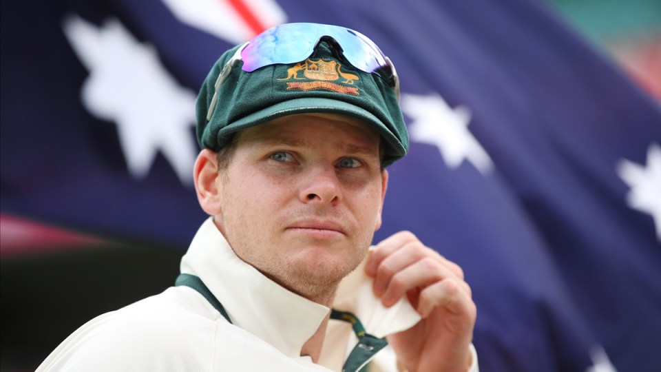 Steve Smith in front of the Australian flag.