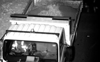 A truck driver using his phone behind the wheel.