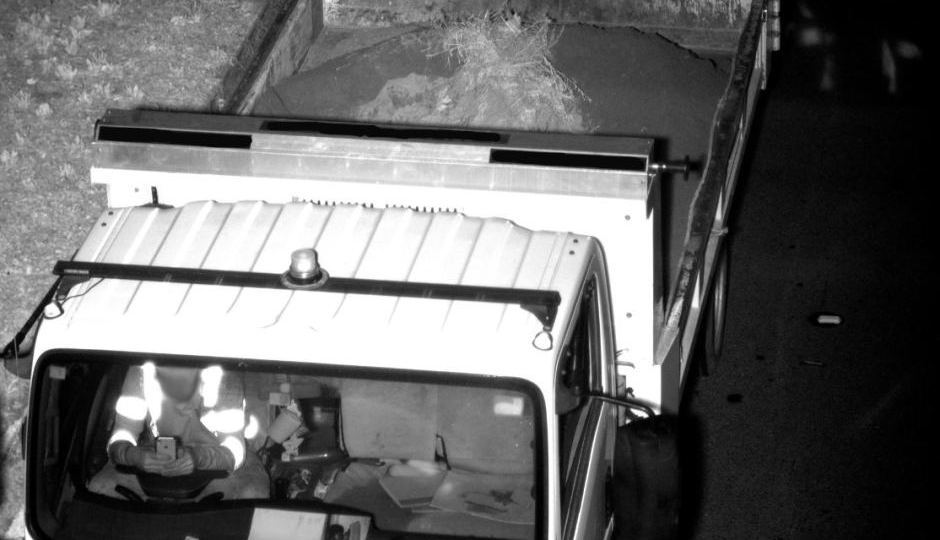 A truck driver using his phone behind the wheel.