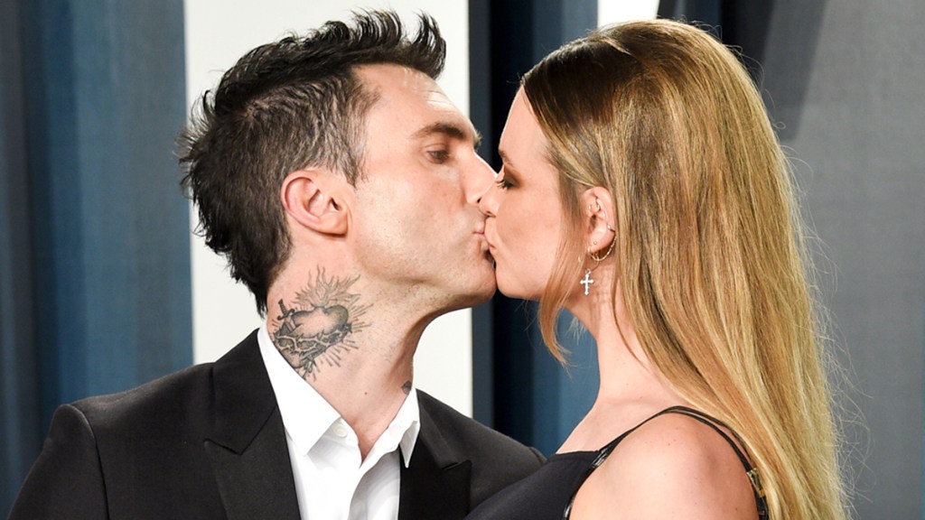 Adam Levine, left, and wife Behati Prinsloo 