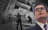 Greg Combet in front of asome workers and money.