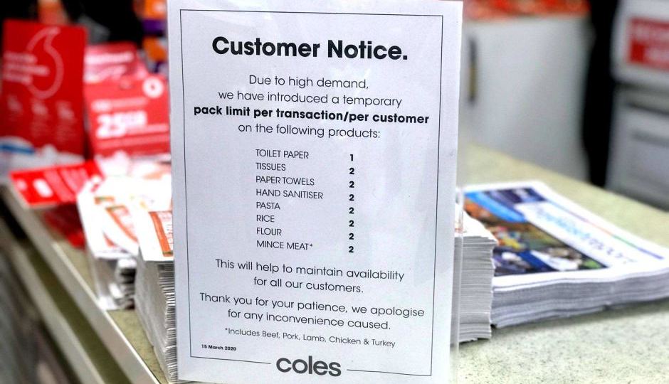 A message to customers at a Coles supermarket limiting purchases of some products.