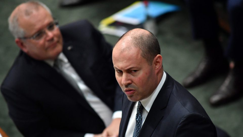 Treasurer Josh Frydenberg (right) reacts alongside Prime Minister Scott Morrison (left) during Question Time in the House of Representatives
