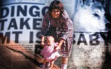 Lindy Chamberlain holds baby Azaria at Uluru.