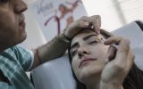 A woman receives a botox injection at a private medical centre in Beirut, Lebanon