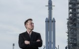Elon Musk poses with the SpaceX Falcon Heavy rocket, NASA's Kennedy Space Center in Cape Canaveral, Fla., Feb. 5, 2018. By inserting himself into the confounding GameStop stock market drama, Musk has solidified his role as the ultimate insider outsider.