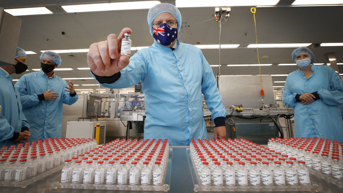 Scott Morrison holds a vial of the AstraZeneca vaccine at the CSL serum lab in Melbourne.