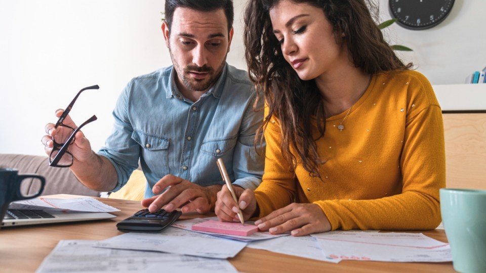Australian couple in their 30s filling out their tax returns
