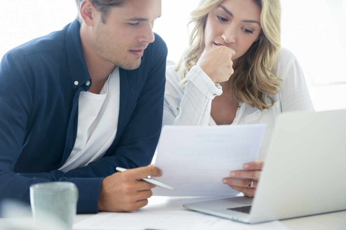 Australian couple in their 30s filling out their tax returns