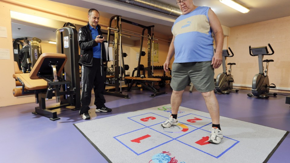 Overweight man exercising