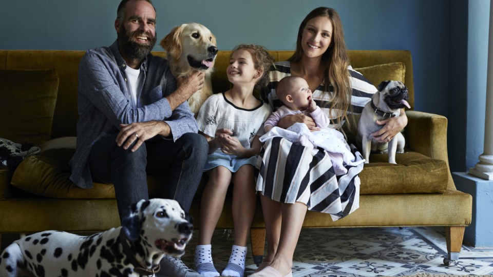 Family sitting on sofa