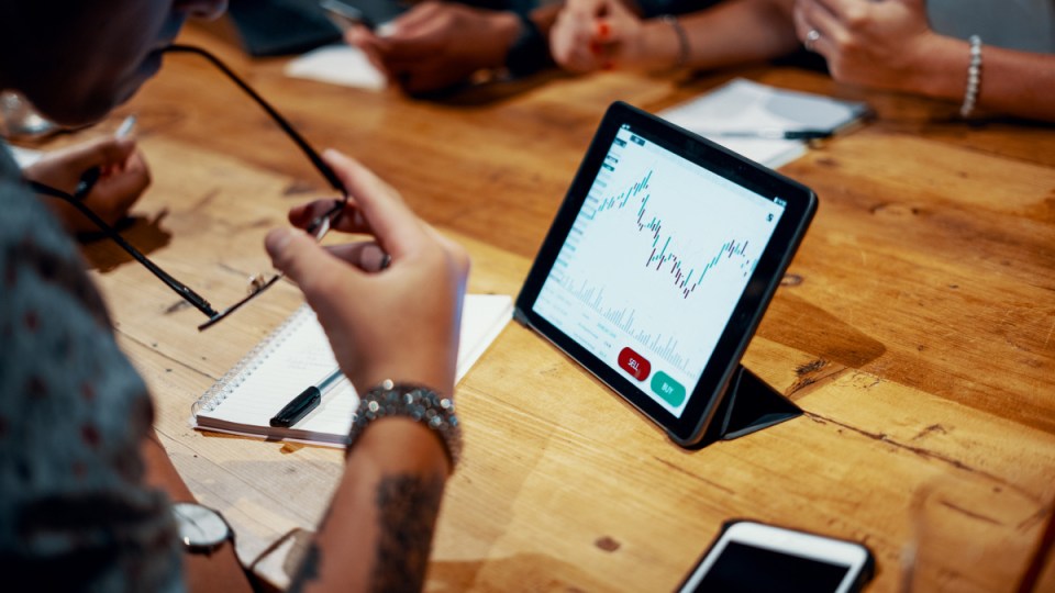 Group of investors checking dividends