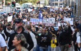 Protesters march along Broadway and George St towards Sydney Town Hall during the ‘World Wide Rally For Freedom’ anti-lockdown rally at Hyde Park in Sydney, Saturday, July 24, 2021.