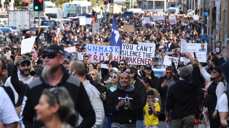 Protesters march along Broadway and George St towards Sydney Town Hall during the ‘World Wide Rally For Freedom’ anti-lockdown rally at Hyde Park in Sydney, Saturday, July 24, 2021.