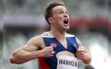 Karsten Warholm celebrates gold.
