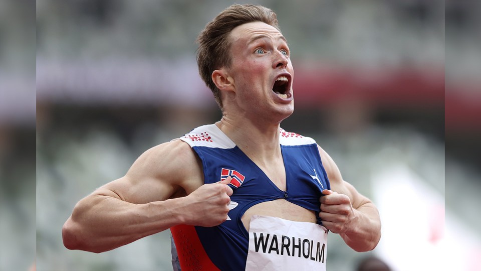 Karsten Warholm celebrates gold.